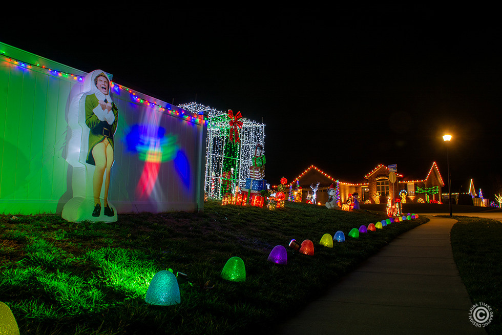 Buddy the Elf is excited to see you along the sidewalk.