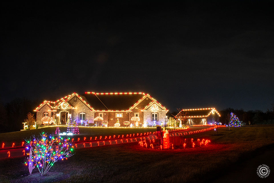 The Christmas lights wrap all the way around the house.