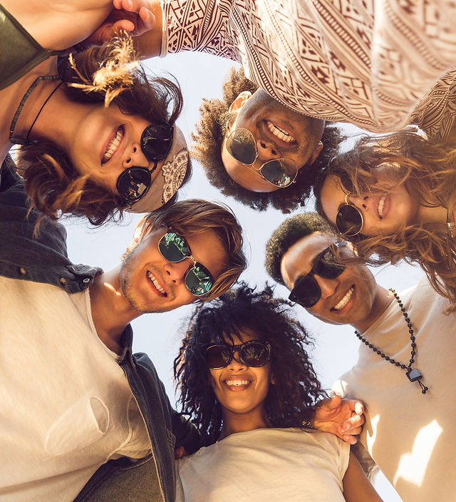 multiethnic-group-of-friends-huddle-join