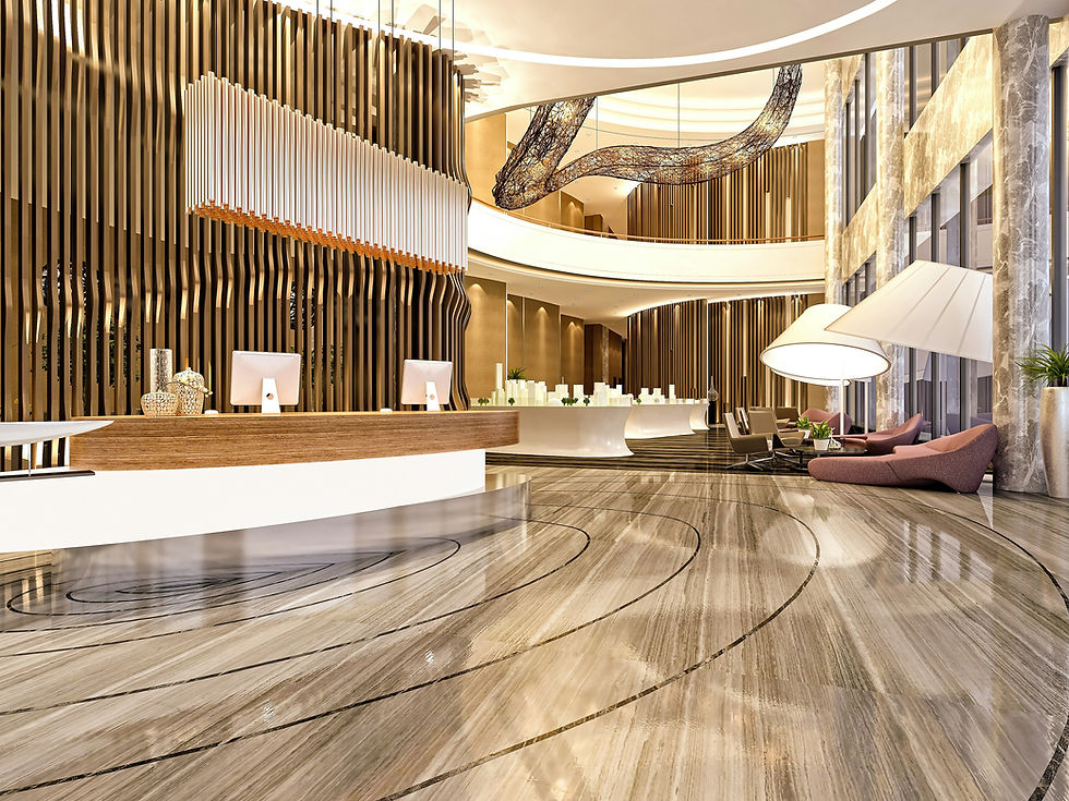 Luxurious hotel lobby with a modern reception desk, sleek marble flooring, tall golden vertical wall panels, large sculptural chandelier, and stylish seating area with contemporary chairs and oversized lamps.