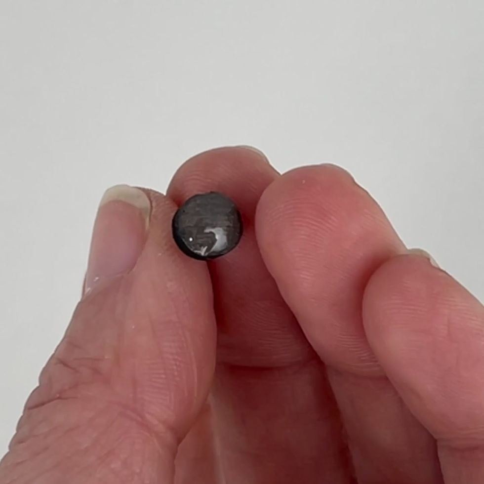 Thumbnail: Handmade glossy wooden minimalistic stud earrings in a circle shape.