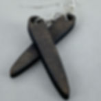 Handmade teardrop wooden earrings that dangle off of a silver plated hook.