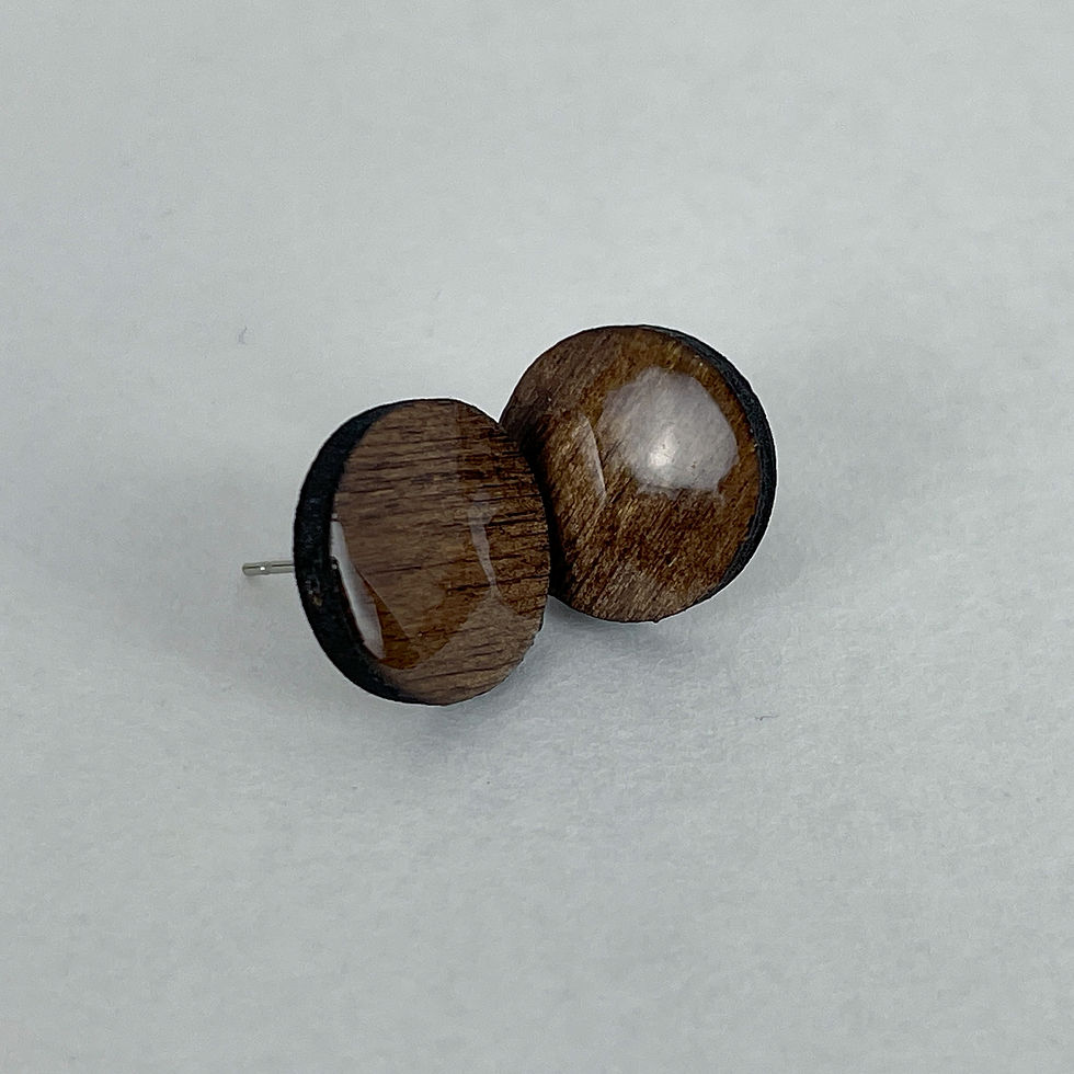 Thumbnail: Handmade glossy wooden minimalistic stud earrings in a circle shape.