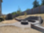 Backyard patio with fire pit, retaining walls & landscaping