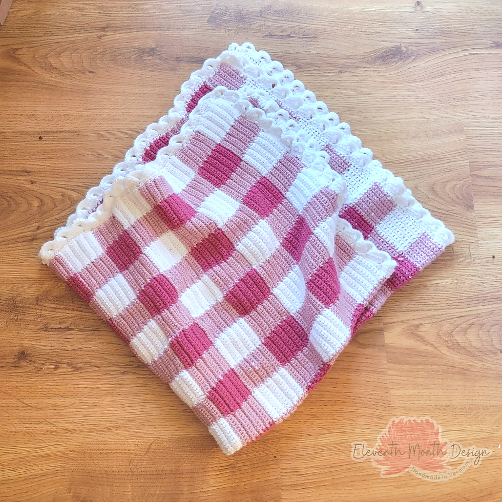 pink crochet gingham blanket folded