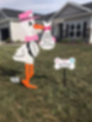 Louna Girl stork with dog bone.jfif