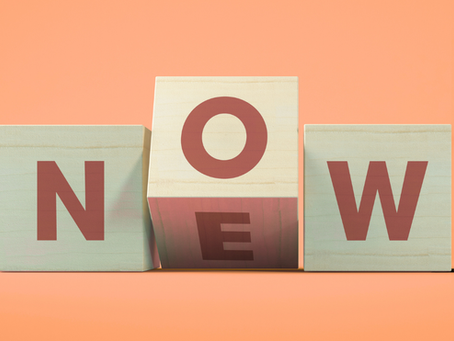 Toy blocks spelling NOW