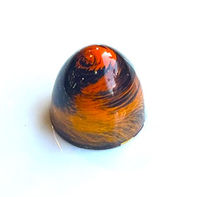 Pumpkin brown butter cheesecake white chocolate ganache in a dark chocolate shell.