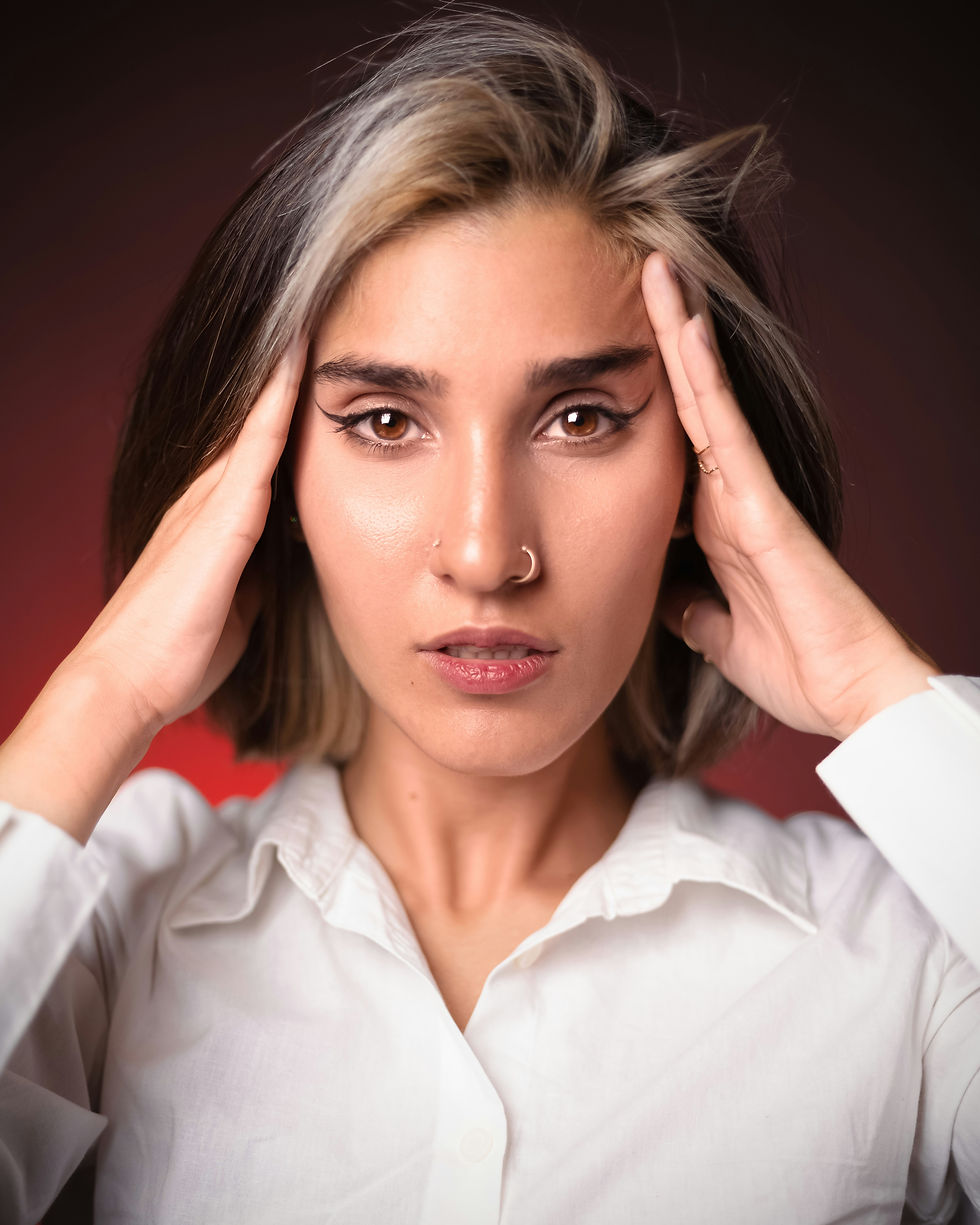 A woman is feeling overwhelmed as she thinks about what factors affect fertility decrease, including chronic stress, which she experiences daily.