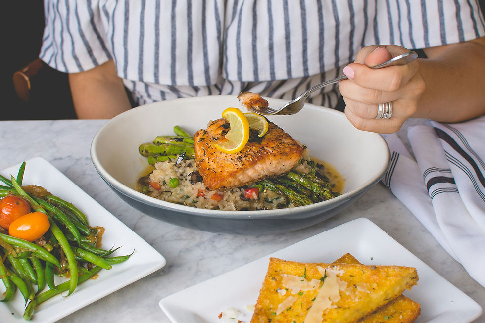 A woman is dining on foods to eat to boost fertility naturally.