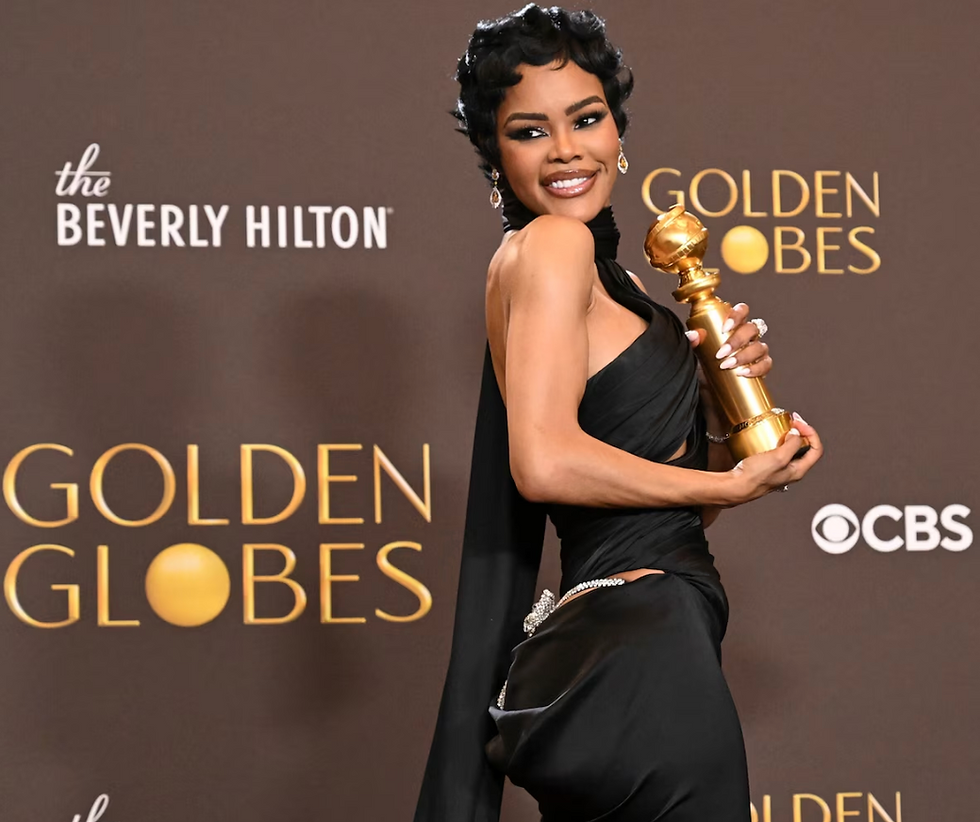 Close-up view of Teyana Taylor’s detailed gown fabric and accessories at the Golden Globes