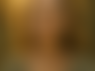 Woman in soft light with her hands over her throat