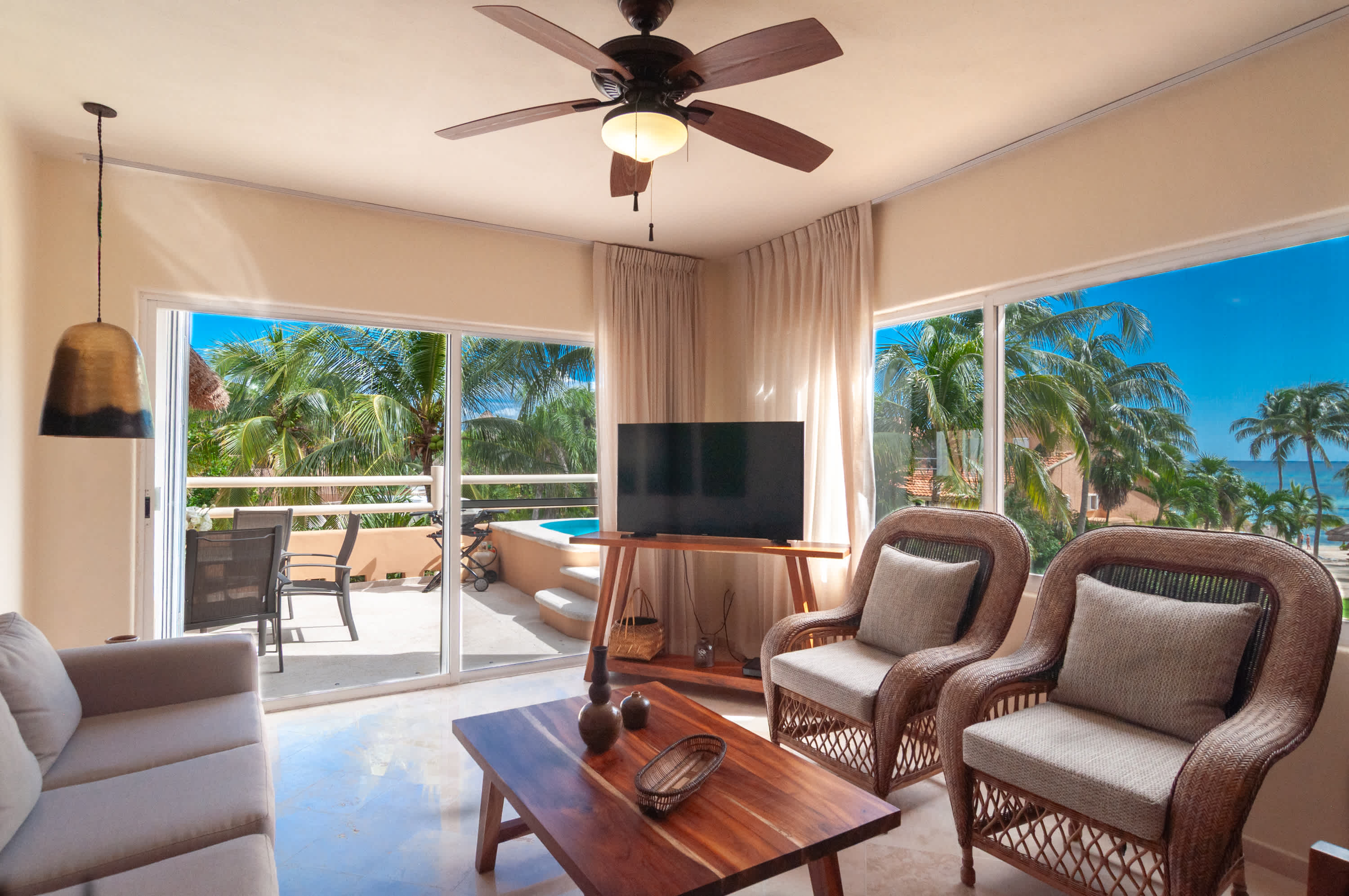 Living room with sea views and terrace access