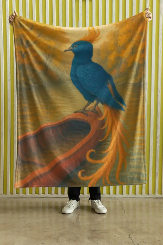 Soft fleece blanket featuring a blue and orange phoenix perched on a red canoe over golden waters