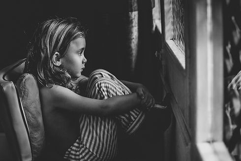 child-sitting-by-the-window.jpg