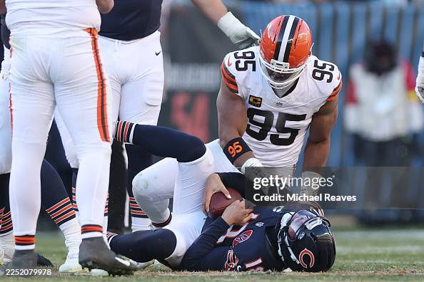 CHICAGO, ILLINOIS - DECEMBER 14: Myles Garrett #95 of the Cleveland Browns sacks Caleb Williams #18 of the Chicago Bears at Soldier Field on December 14, 2025 in Chicago, Illinois. (Photo by Michael Reaves/Getty Images)