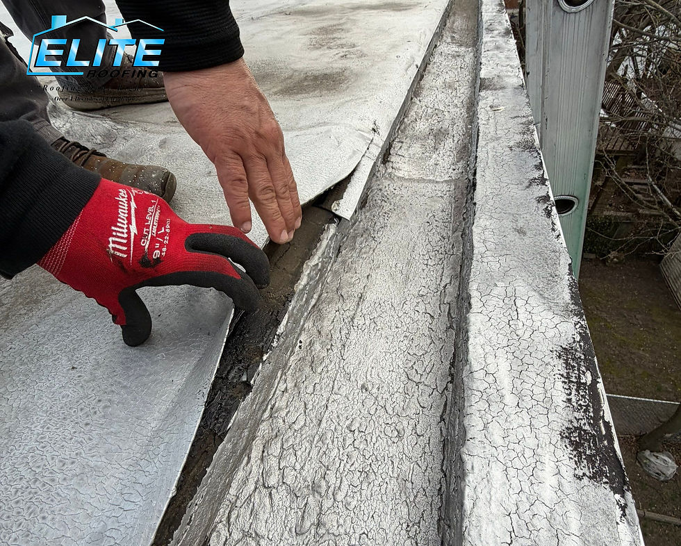 Lifting roofing membrane caused by natural aging and wear on a flat roof in Jersey City, New Jersey.