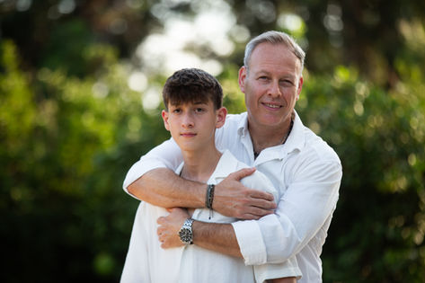 Bar Mitzvah. Father and son smiling together.
