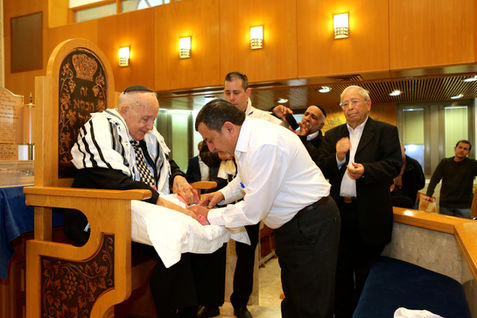 Man during a Bris ceremony, dafnatalmon
