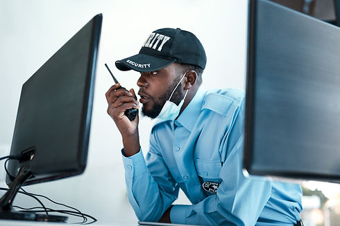 Your direct connection to first rate protection. Shot of a young security guard using a tw