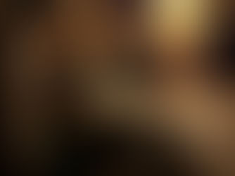 Ancient art of alchemy in Prague, Czech Republic. Dimly lit rustic cellar with stone walls, wooden shelves, pottery, and tools. A glowing lamp adds warmth. Quiet, historical ambiance.