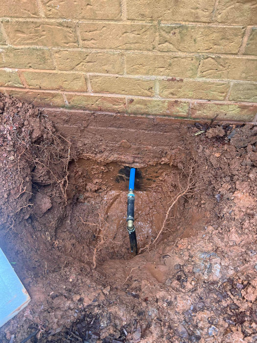New water line from brick of house