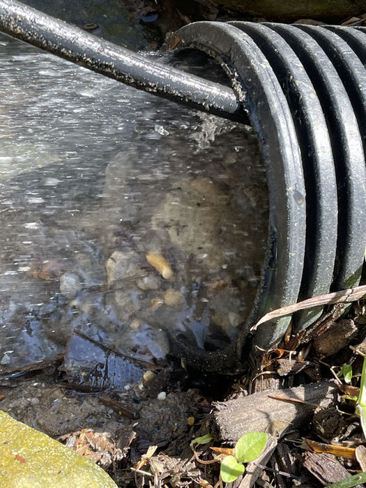 Hydro jetting flow of water through storm drain pipe