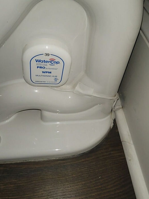 WaterCop leak detection sensor installed at toilet