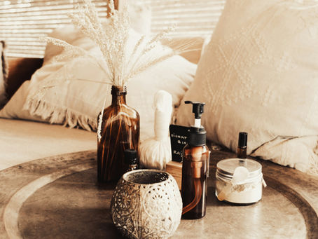 Ayurvedic items on a try near pillows and windows to represent Ayurvedic tips to reduce back-to-school stress for parents
