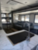 Interior of Keystone Bullet 290BHS with kitchen, living area, and bunk beds