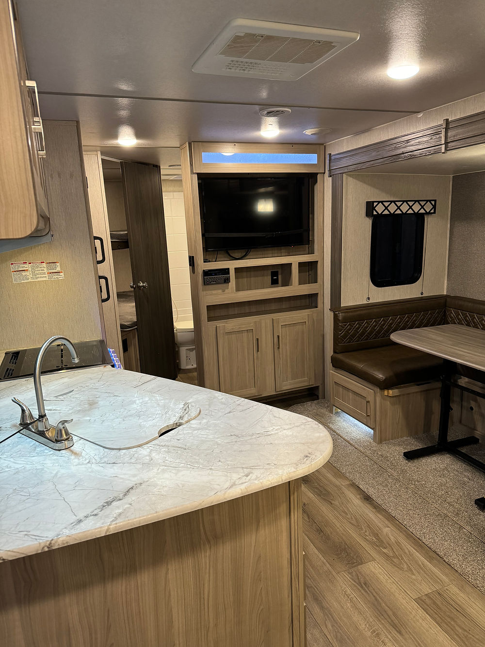 2020 Coachman Freedom Express RV interior with kitchen and dinette