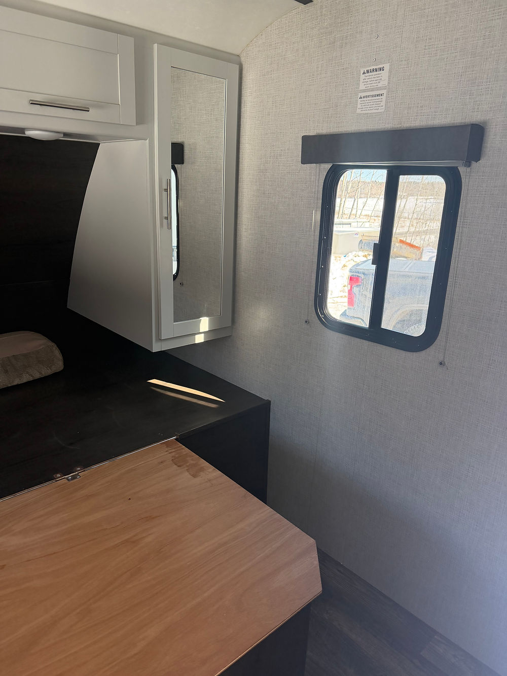 Keystone Bullet 290BHS interior bedroom with bed and window