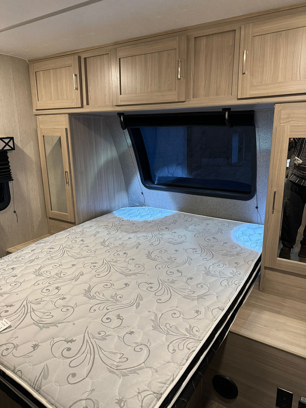 2020 Coachman Freedom Express RV bedroom with bed and cabinets