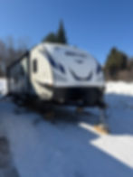 Keystone Bullet 290BHS travel trailer parked in snow