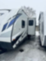2019 Keystone Bullet 290BHS travel trailer, side view with open door