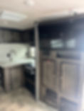 2019 Heartland Mallard RV interior with kitchen and TV