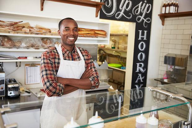 owner-behind-the-counter-of-sandwich-bar-with-arms-2024-10-20-22-57-35-utc.jpg