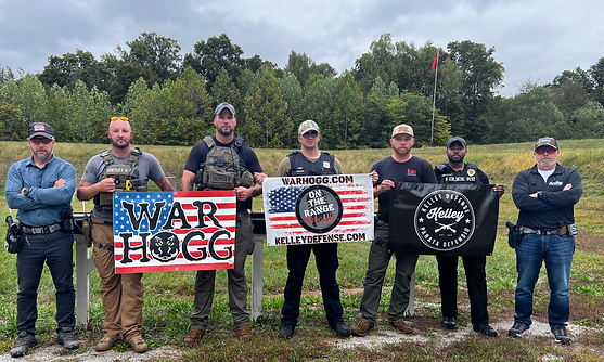 Law enforcement K9 officers training with War HOGG Tactical conducting One handed pistol shooting for the K9 Officer