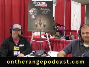 Rick Hogg, Mark Kelley and Mike from ICC Ammo wearing headsets talk at a podcast booth with red and white curtains. A poster and "ontherangepodcast.com" are visible.