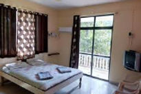 tendulkar-beach-resort-bed-room_edited.jpg