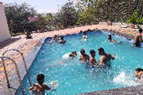 hotel-vanraj-krishi-paryatan-kendra-tourist-enjoying-in-swimming-pool_edited.jpg