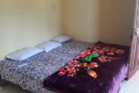 nisarg-bungalow-tourist-home-bed-room_edited.jpg