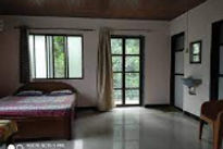 suvarna-holiday-home-bed-room_edited.jpg