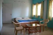 nisarg-chaya-hotel-bed-room_edited.jpg