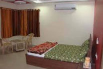 hotel-arya-inn-bed-room_edited.jpg