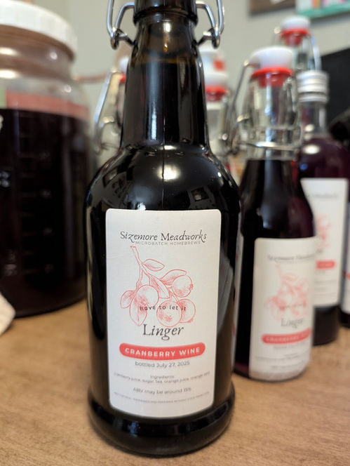 Several bottles with elegant labels, designed by Gray.