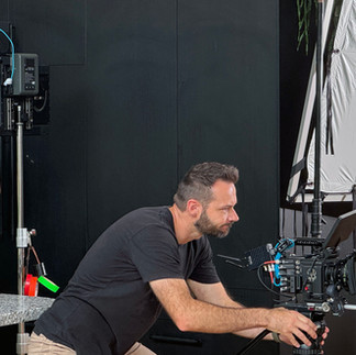 Behind the scenes showing our director / cinematographer in action