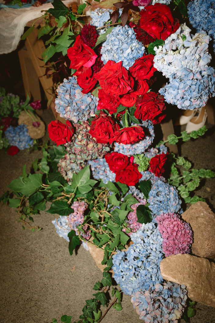red and blue floral cascading garland wedding at the hunting lodge Auckland 