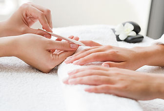 Removing cuticles from nails.