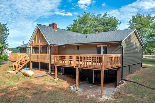 Large deck addition to house